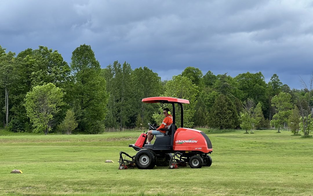 Kurt cutting the grass at Ironwoods Golf Course